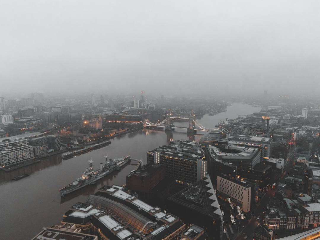 London Skyline View With River And Smog